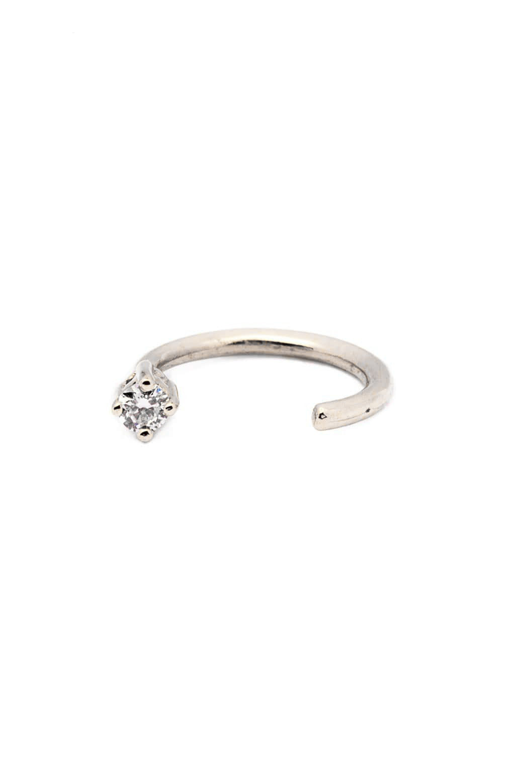 Four claws white 18k gold piercing with diamond, front view