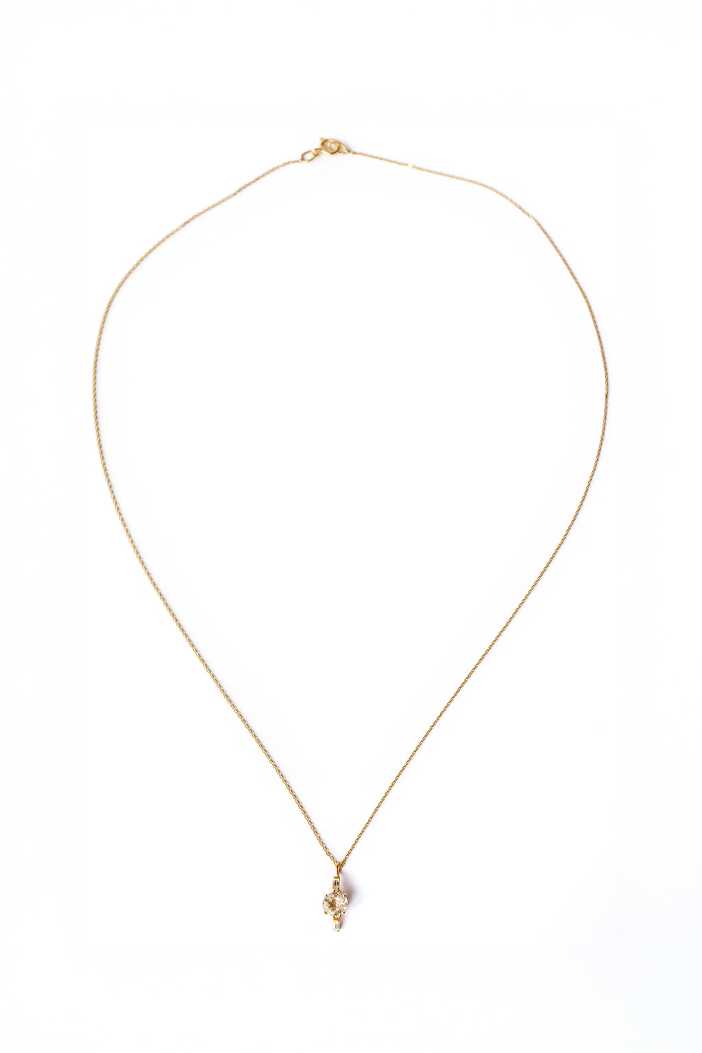 Drop Baguettes Gold Necklace in 18k yellow gold with diamonds and a 5 mm topaz, designed by Sansoeurs.