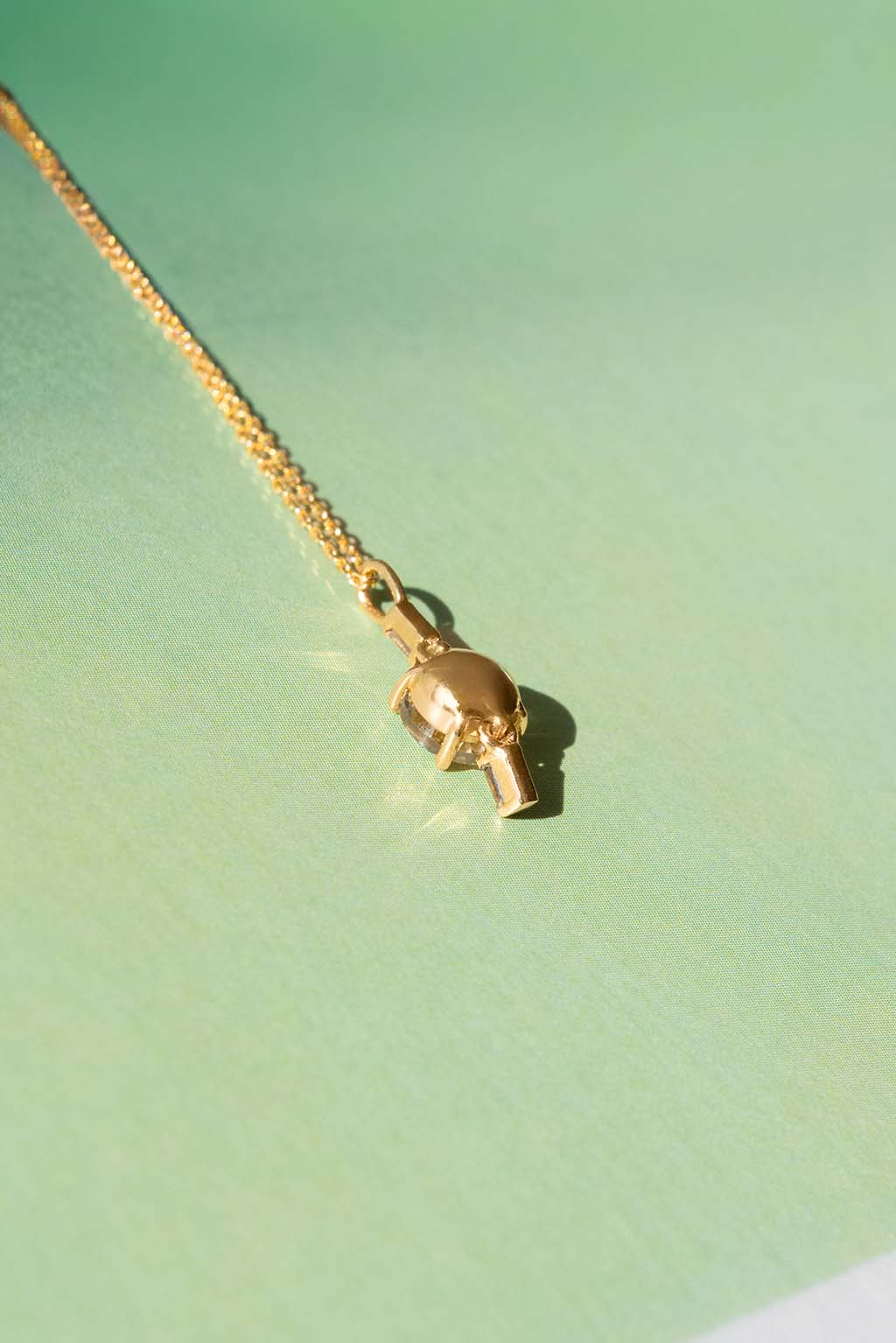Drop Baguettes Gold Necklace in 18k yellow gold with diamonds and a 5 mm topaz, designed by Sansoeurs.