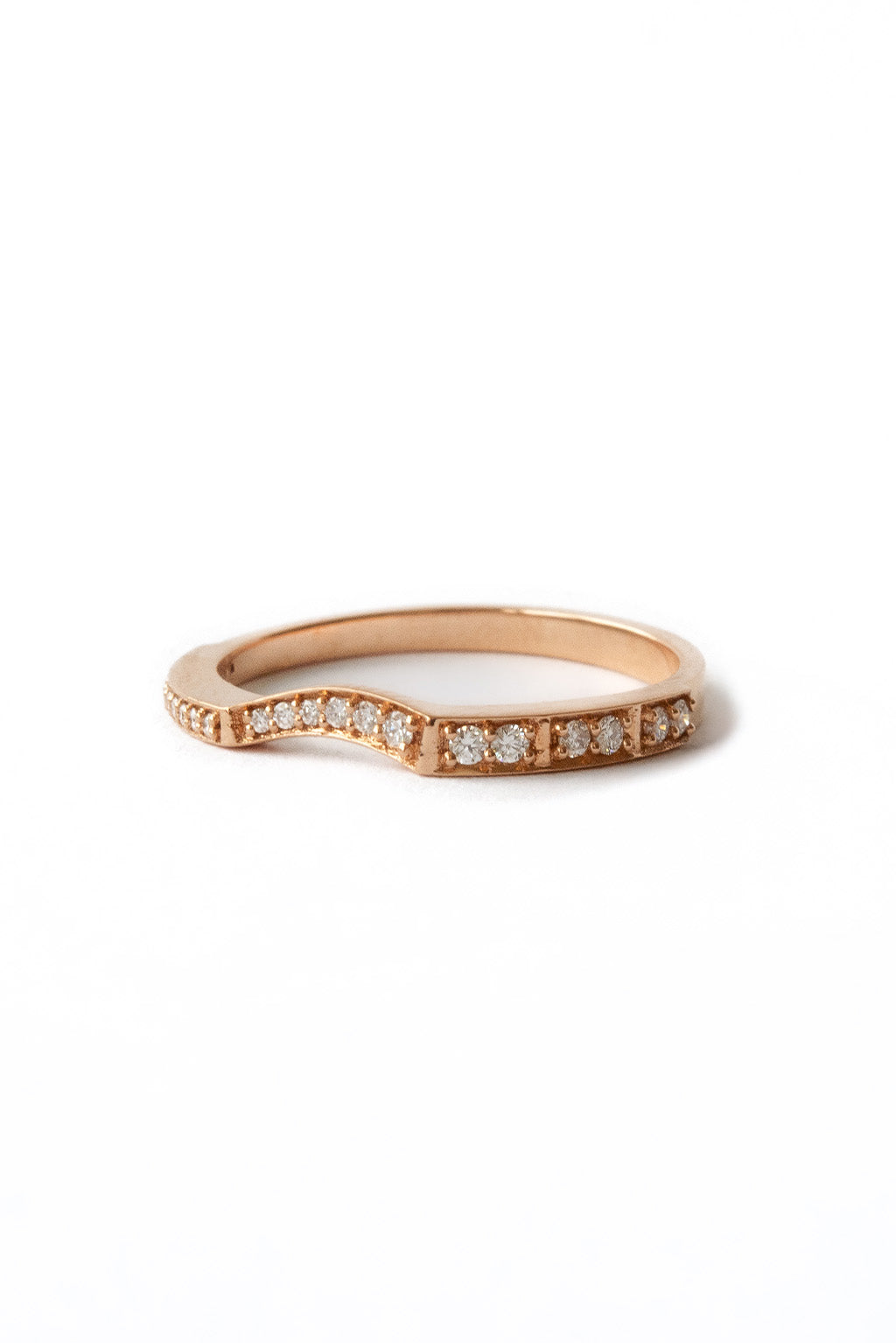 Irregular 18k gold ring with sculptural finish on white background