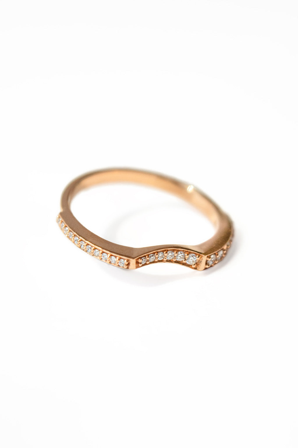 Irregular 18k gold ring with sculptural finish on white background