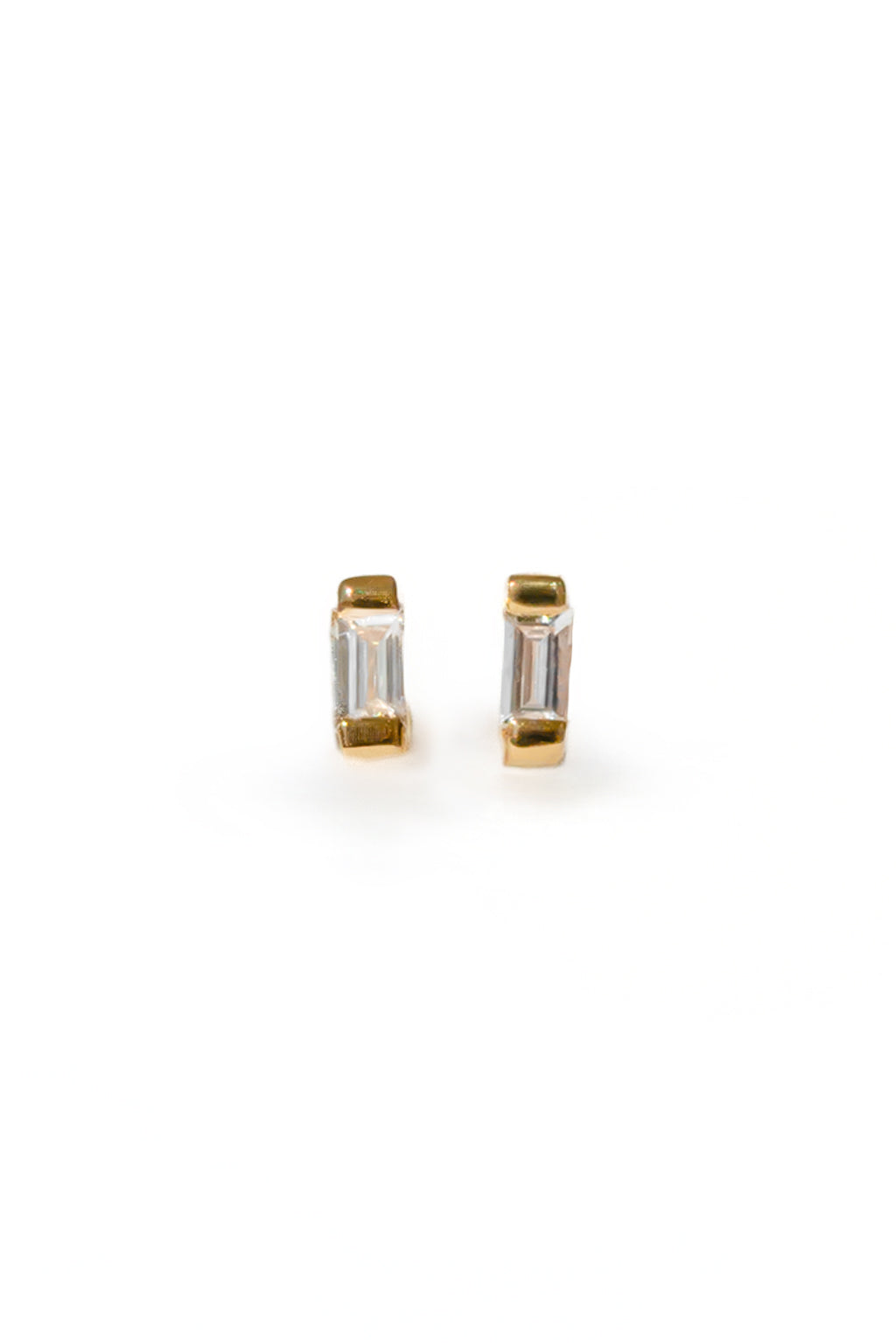 Baguette gold and diamond baby earrings by Sansoeurs, diamond set between two small gold plates