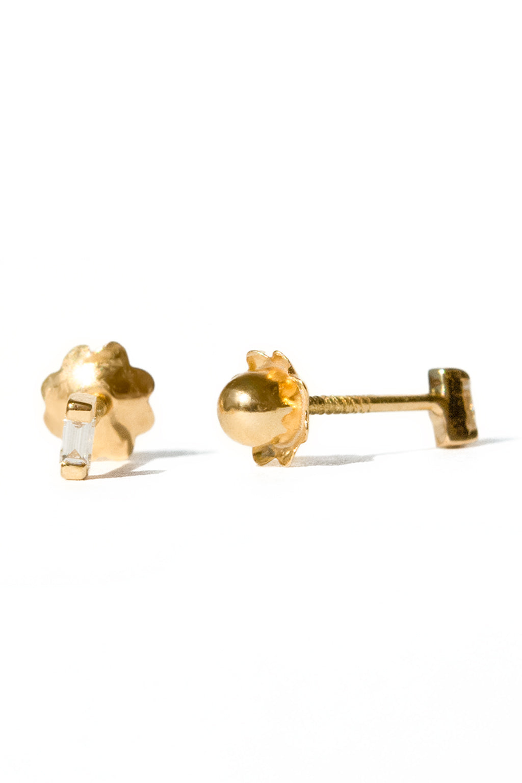 Baguette gold and diamond baby earrings by Sansoeurs, diamond set between two small gold plates