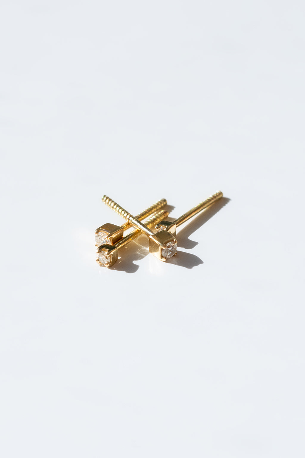 Box gold and diamond baby earrings by Sansoeurs, diamond set in square gold bezel