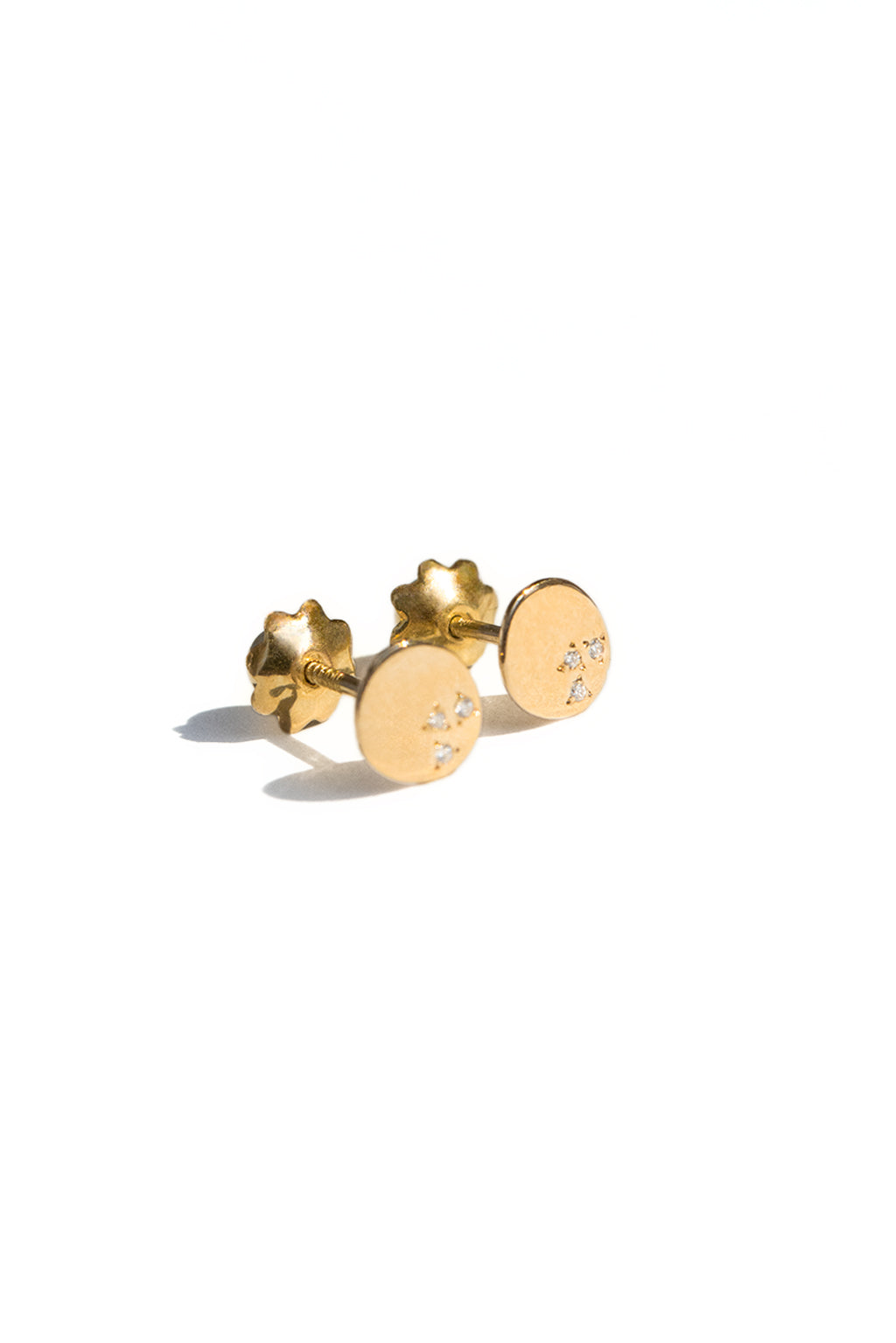 Dots gold and diamonds baby earrings by Sansoeurs, oval gold studs with three diamonds