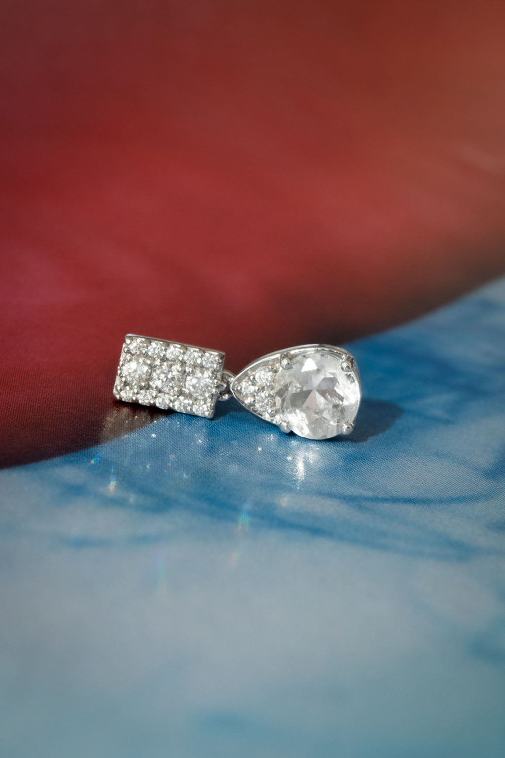 Topaz Small Drop Earring in 18k white gold with diamonds, featuring a 5 mm topaz, designed by Sansoeurs.