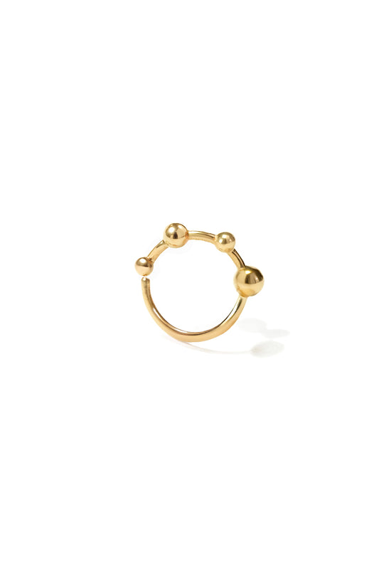 18k yellow gold mini bangle earring with four sculpted spheres, seen from the front on a white background