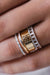 Marquise Brown Diamonds Band Ring in 18k yellow gold with brown diamonds, handcrafted by Sansoeurs, worn on model’s hand.
