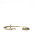 Opened gold oval bracelet with matte finish on white background
