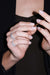 Irregular Full Band Diamonds Ring in 18k gold with diamonds, handcrafted by Sansoeurs, worn on model’s hand.
