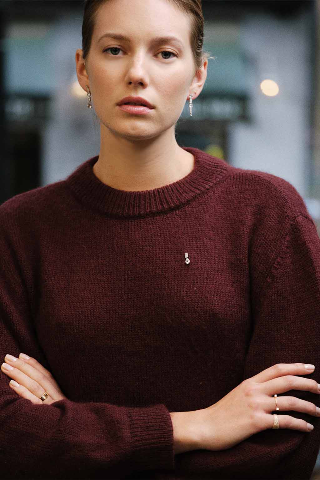 Small Miki Two Diamonds Gold Ring in 18k rose gold, handcrafted by Sansoeurs, worn on model’s hand.