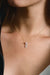 Wife Topaz Pendant in white 18k gold with diamonds and pear-shaped topaz, handcrafted by Sansoeurs, worn on model.