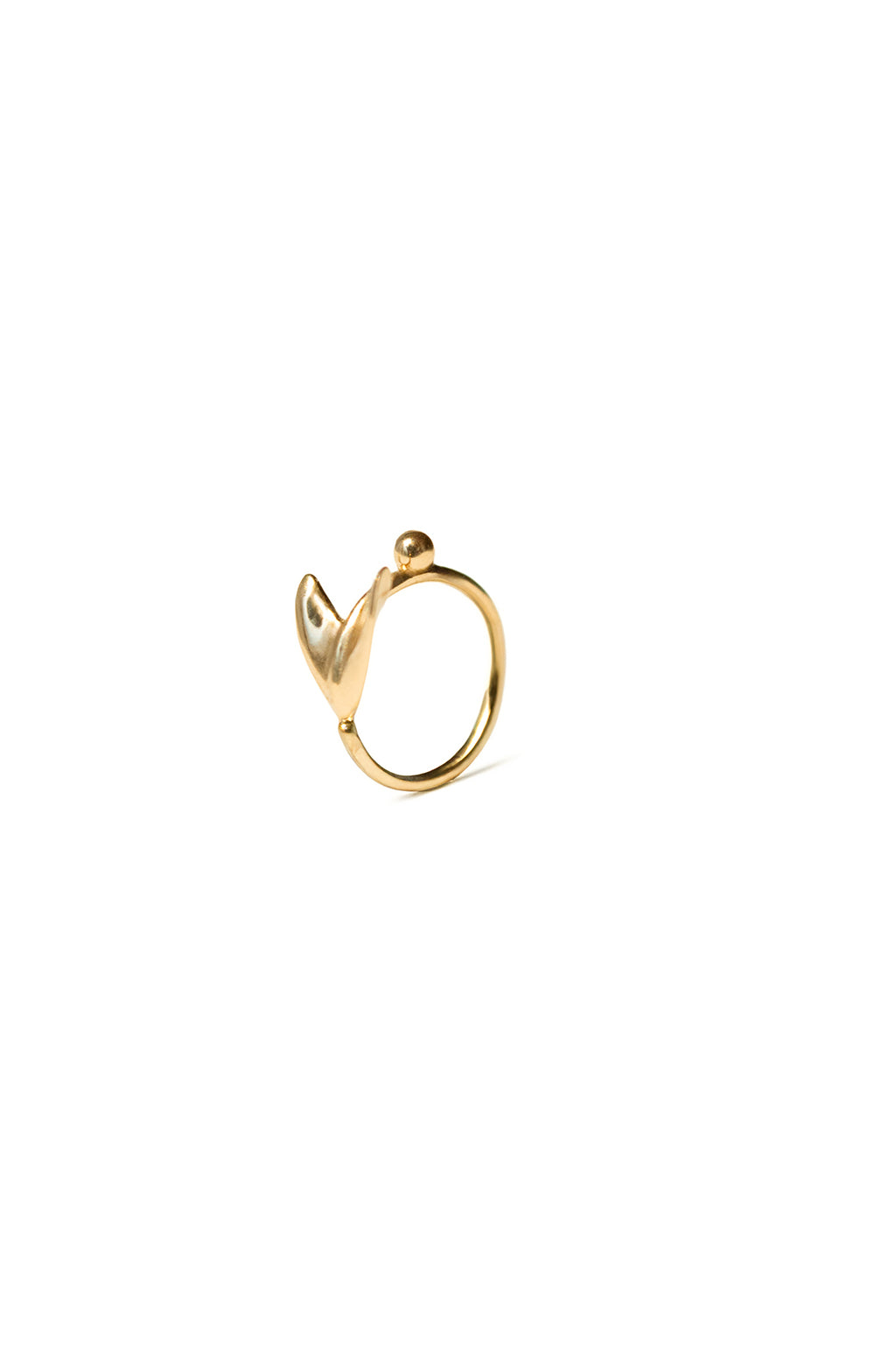 Close-up of the Floral Mini Bangle in 18k gold by Sansoeurs, featuring an arrow-like organic form and small sphere
