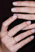 Irregular Full Band Diamonds Ring in 18k gold with diamonds, handcrafted by Sansoeurs, worn on model’s hand.
