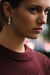 Long Wife Morganite Gold Earring in 18k white gold with diamonds, topaz and morganite, designed by Sansoeurs, worn on model.
