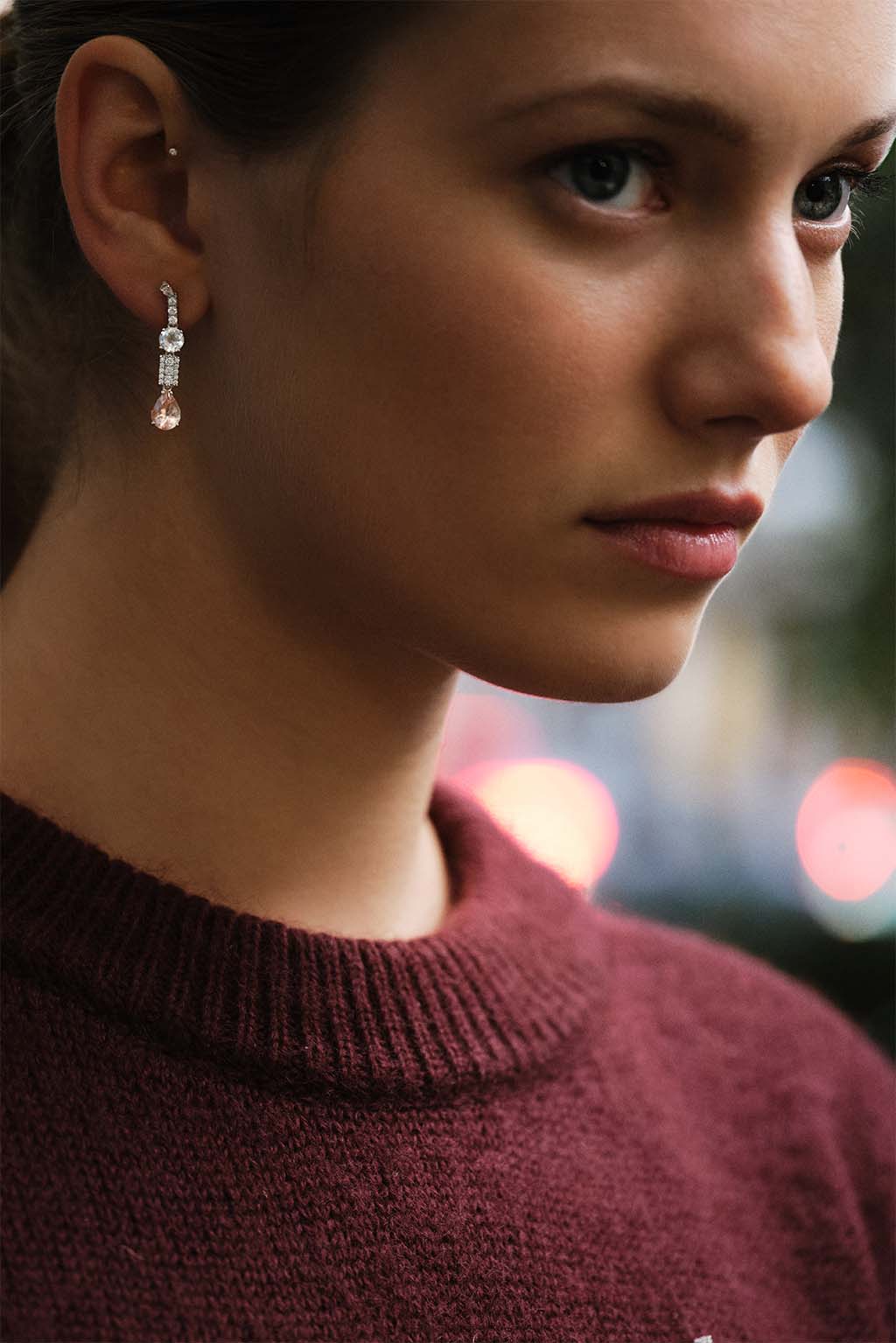 Long Wife Morganite Gold Earring in 18k white gold with diamonds, topaz and morganite, designed by Sansoeurs, worn on model.
