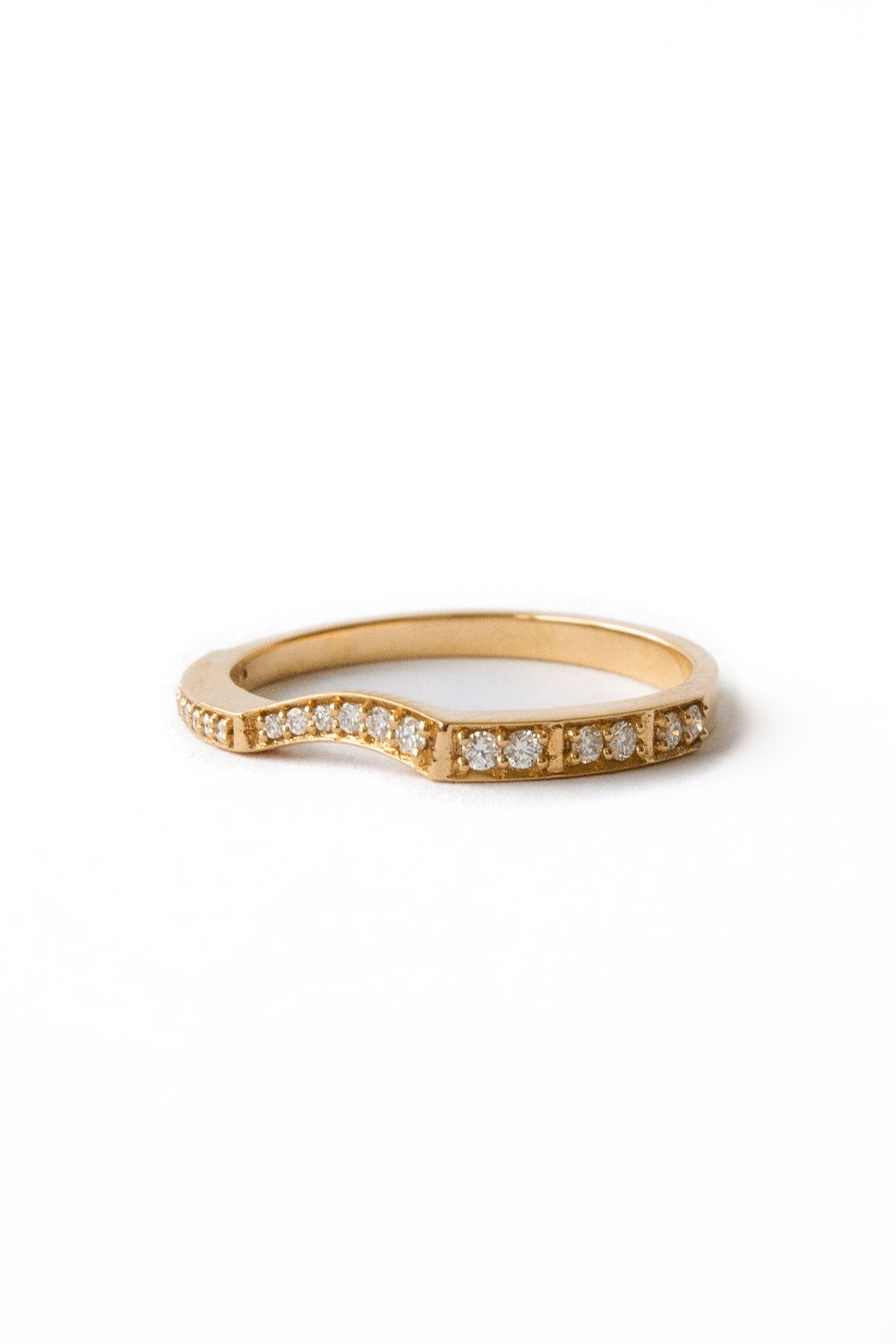 Irregular 18k gold ring with sculptural finish on white background