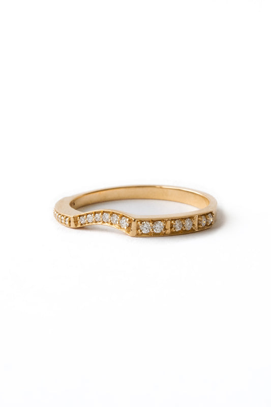 Irregular 18k gold ring with sculptural finish on white background