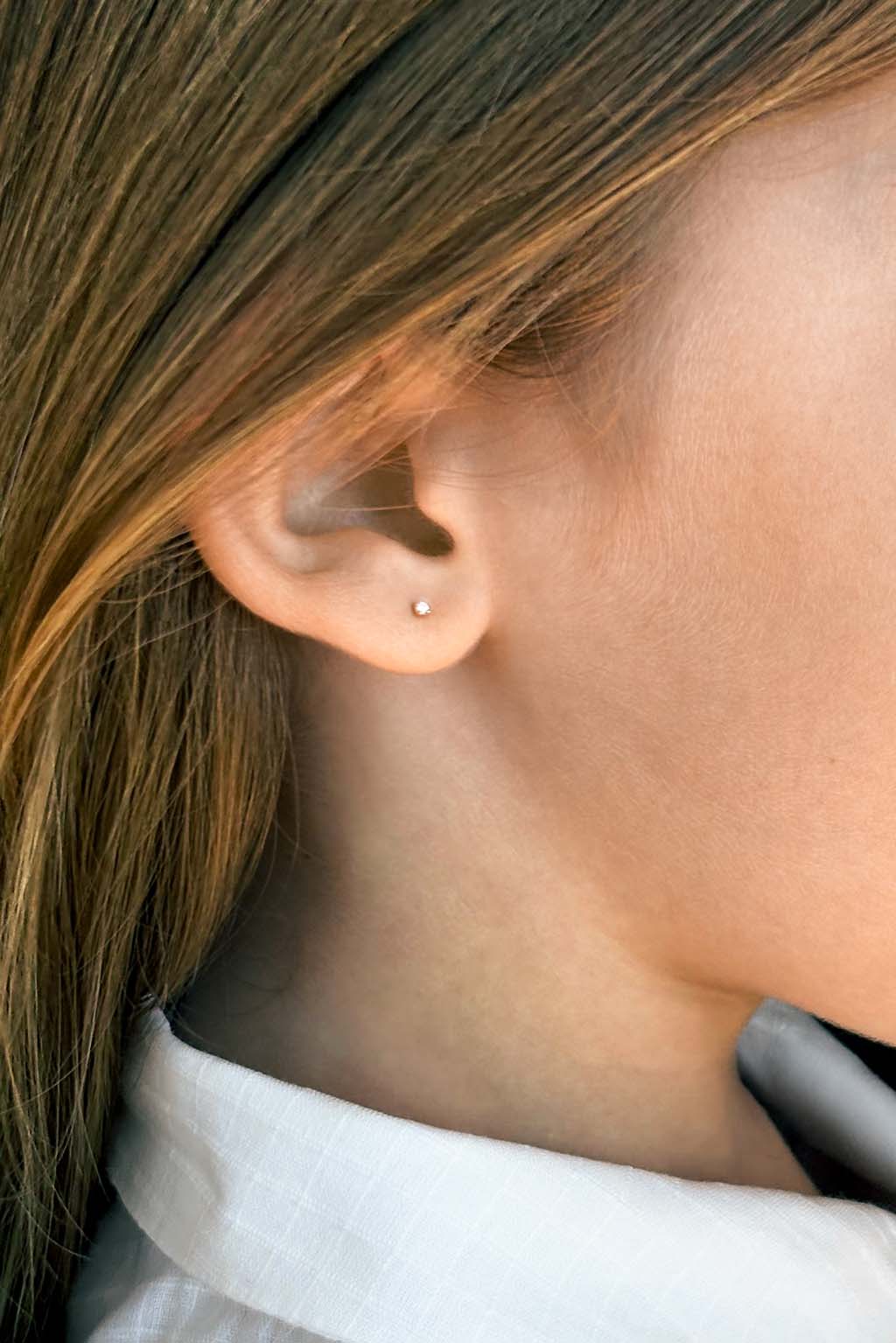 Box gold and diamond baby earrings by Sansoeurs, diamond set in square gold bezel