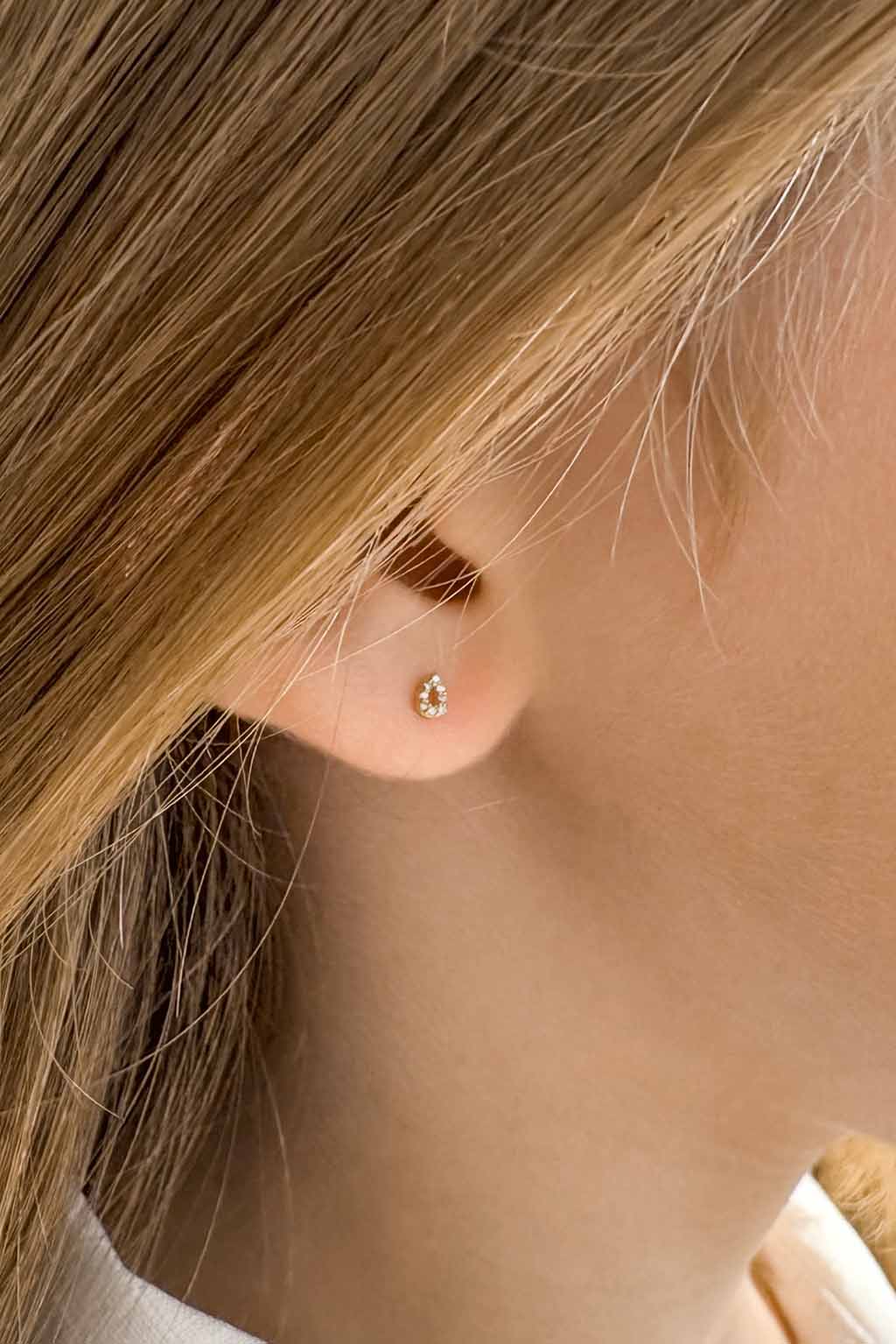 Bubbles gold and diamonds baby earrings by Sansoeurs, drop-shaped studs with diamonds