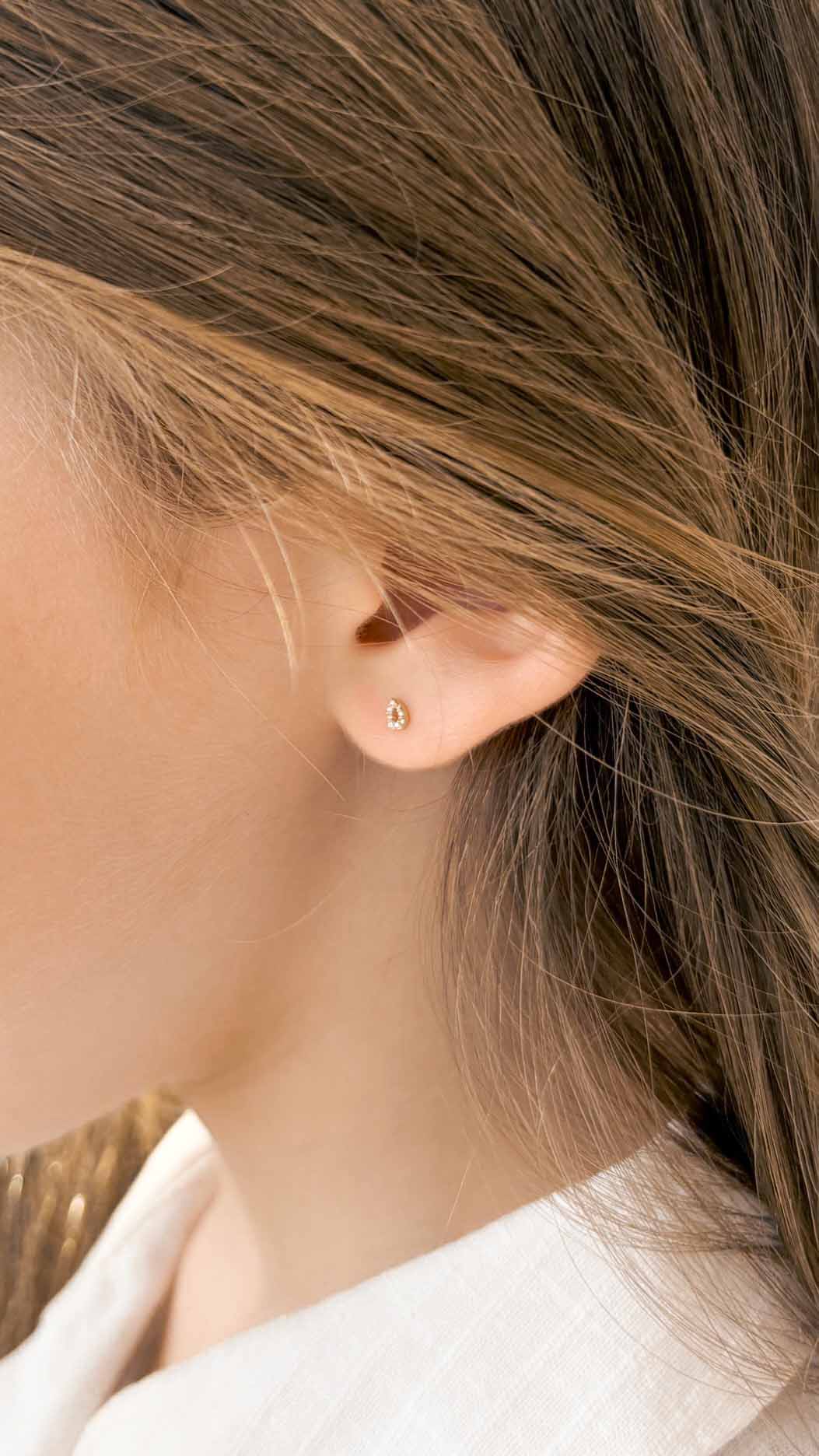 Bubbles gold and diamonds baby earrings by Sansoeurs, drop-shaped studs with diamonds