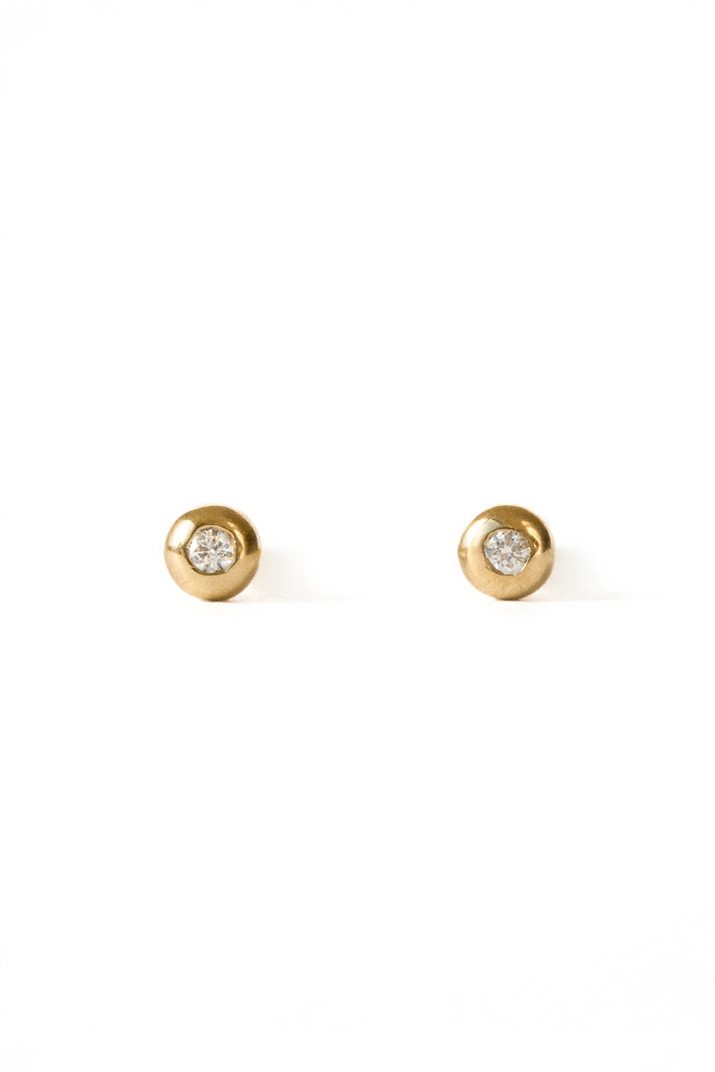 Eye gold and diamond baby earrings by Sansoeurs, diamond set in circular gold bezel