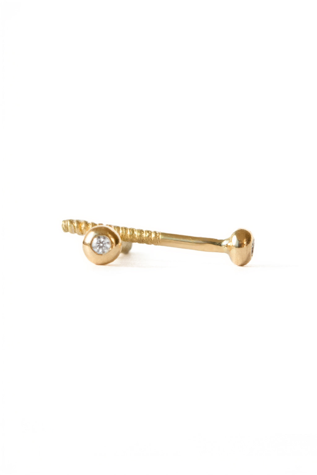 Eye gold and diamond baby earrings by Sansoeurs, diamond set in circular gold bezel