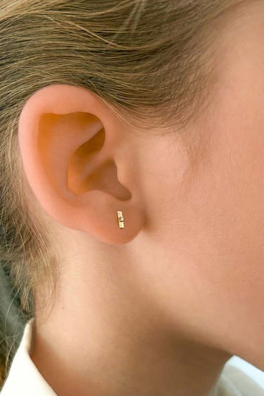 Plaque Tag gold and diamond baby earrings by Sansoeurs, tiny rectangular gold studs with a central diamond