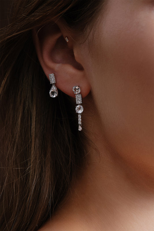 Model wearing the 18k white gold Wife Topaz earring by Sansoeurs, shown alongside the Long Wife Topaz design.