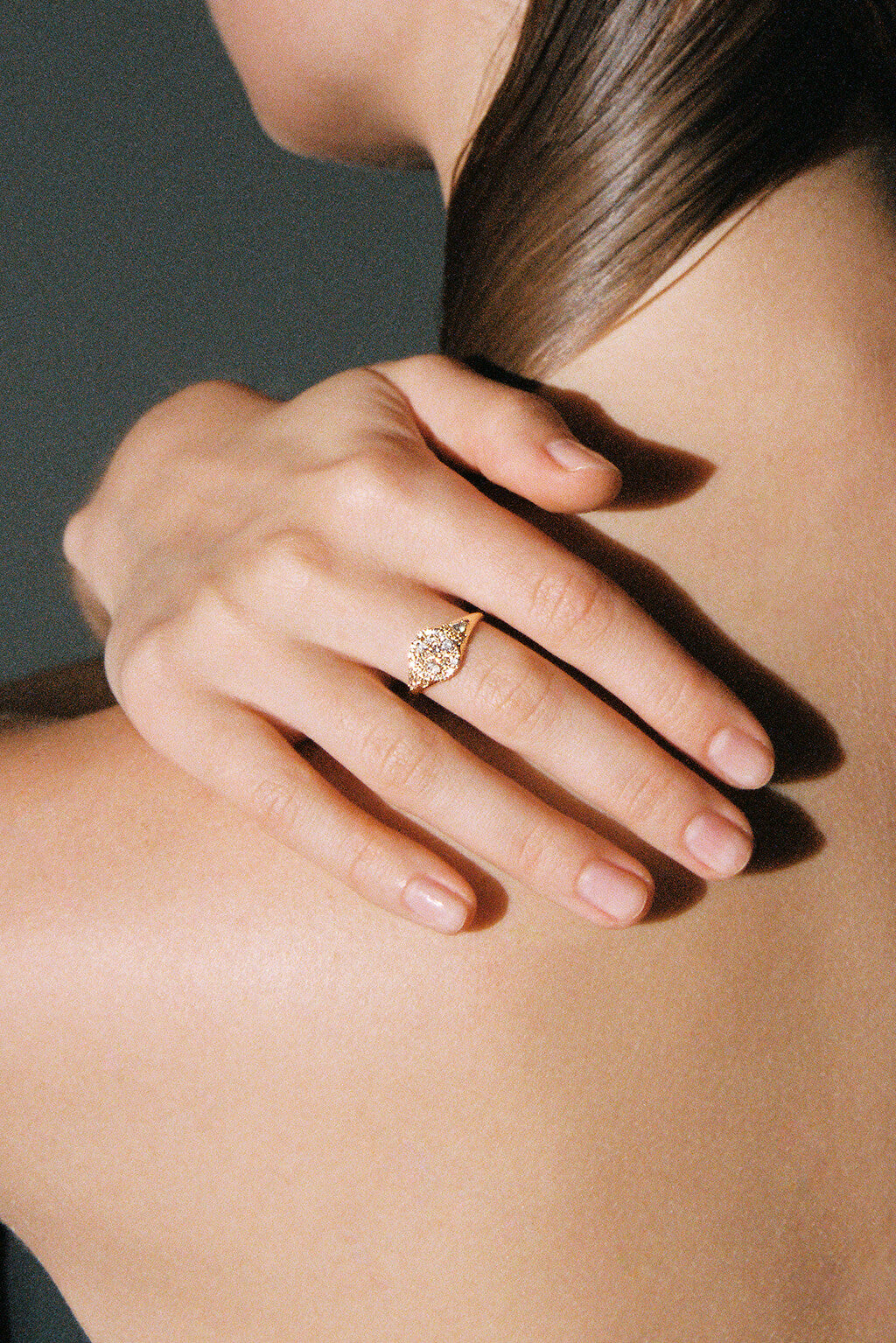 Sugar Signet Gold Ring in 18k gold with diamonds, handcrafted by Sansoeurs, worn on model’s hand.
